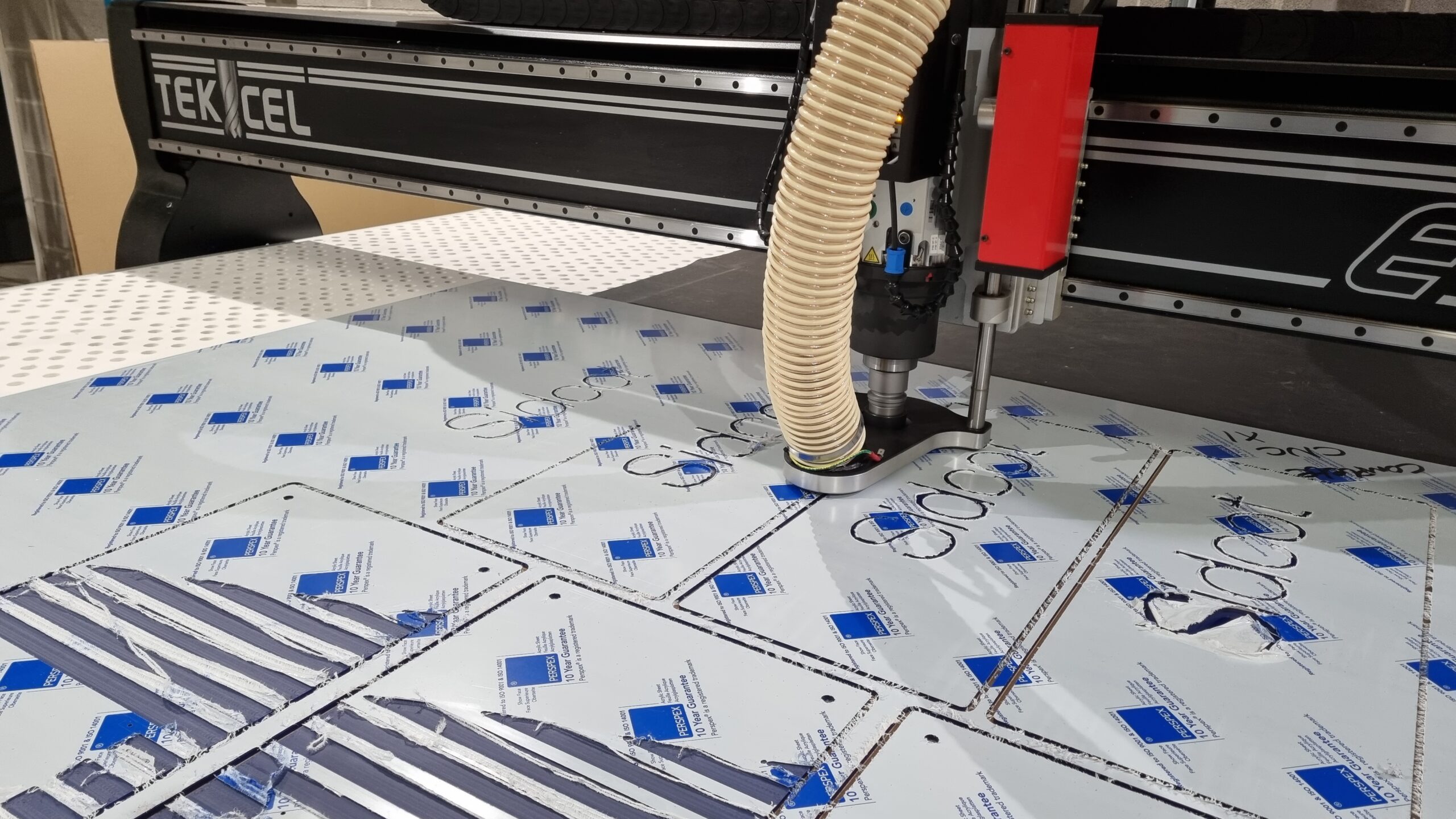 Complete CNC | Tekcel EXR CNC router cutting components from sheet material
